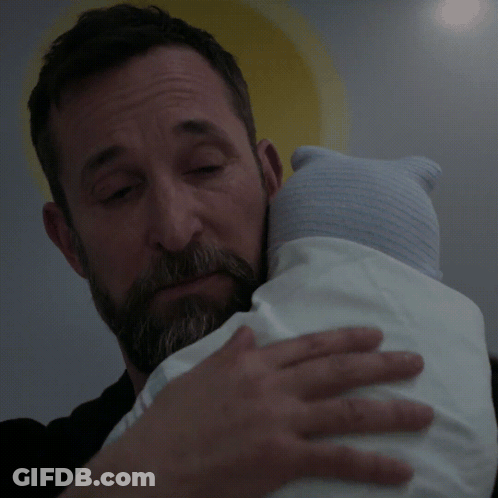 Bearded Man Holding Baby With Blue Hat GIF