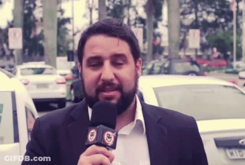 Bearded Man Holding BD Microphone GIF