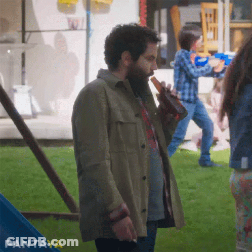 Bearded Man Holding Beer And Smoking GIF