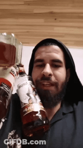Bearded Man Holding Bordo Bottle GIF