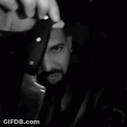Bearded Man Holding Bottle GIF