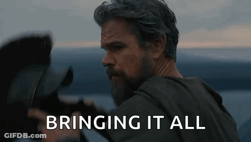 Bearded Man Holding Camera In Front Of Water GIF