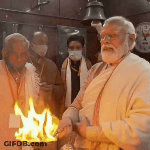 Bearded Man Holding Candle By Clock Saying 10 GIF