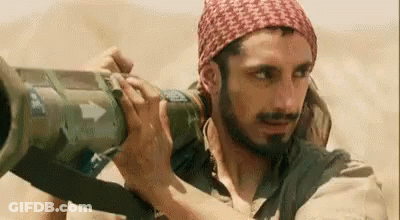 Bearded Man Holding Cannon GIF