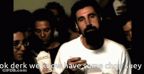Bearded Man Holding Chop Suey In Front Of Group GIF
