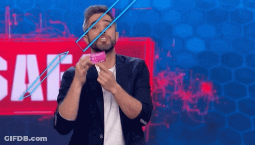Bearded Man Holding Condom In Front Of Sale Sign GIF