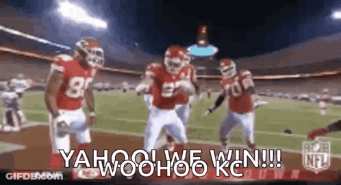 Bearded Man Holding Football In Front Of Jerseys GIF