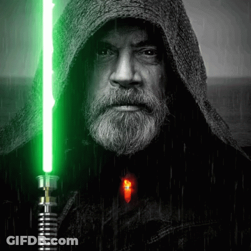 Bearded Man Holding Green Lightsaber GIF