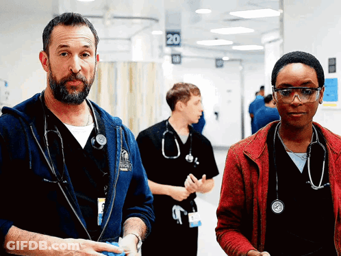 Bearded Man Holding Guitar In Front Of Crowd GIF