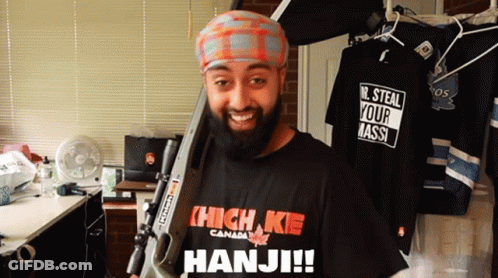 Bearded Man Holding Gun In High Kie Shirt GIF
