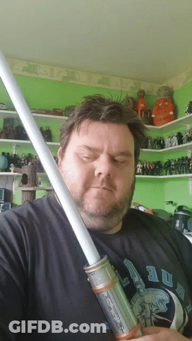 Bearded Man Holding Light Saber GIF