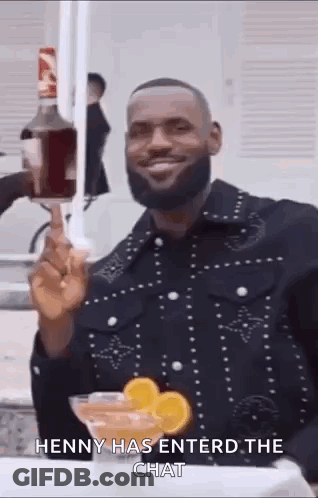 Bearded Man Holding Liquor Bottle And Martini Glass GIF