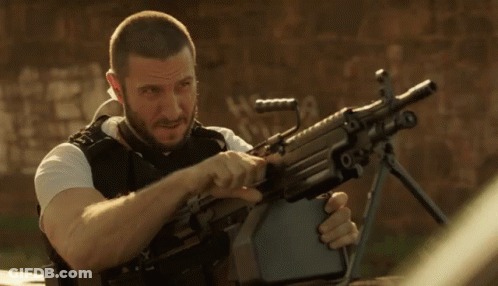 Bearded Man Holding Machine Gun With Letter R GIF