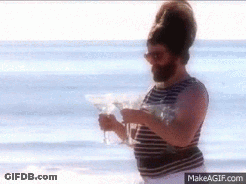 Bearded Man Holding Martini Glasses GIF