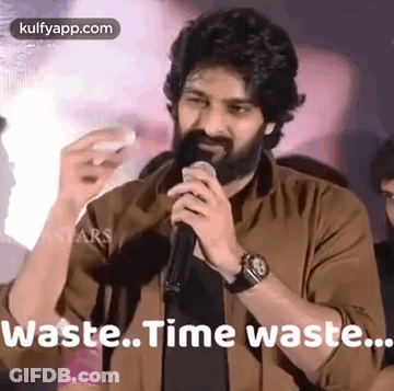 Bearded Man Holding Microphone Saying Waste Time Waste GIF