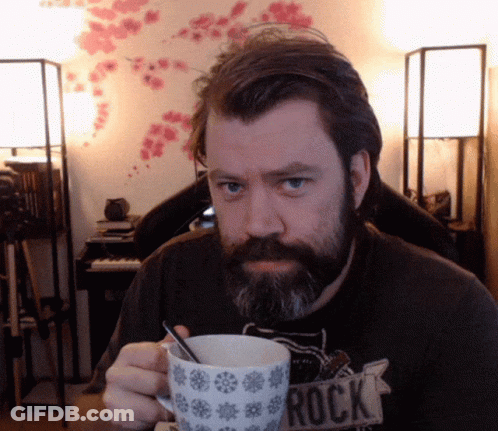 Bearded Man Holding Mug Saying Rock GIF