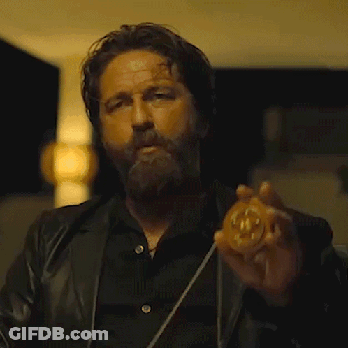 Bearded Man Holding Number 10 Coin GIF