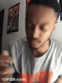 Bearded Man Holding Pen Making Face GIF