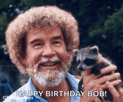 Bearded Man Holding Raccoon GIF