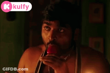 Bearded Man Holding Red Object In Mouth With Kulfy Logo GIF