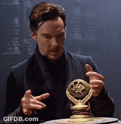 Bearded Man Holding Statue And Looking GIF
