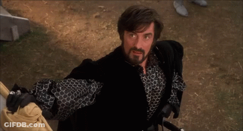 Bearded Man Holding Sword In Black Jacket GIF