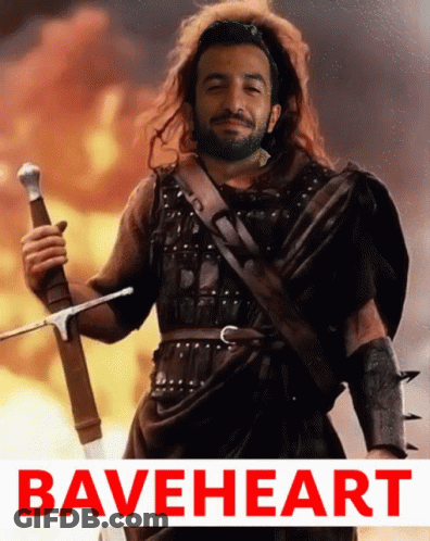 Bearded Man Holding Sword In Front Of Fire Braveheart GIF