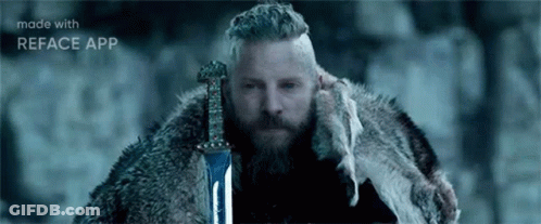 Bearded Man Holding Sword In Snow GIF