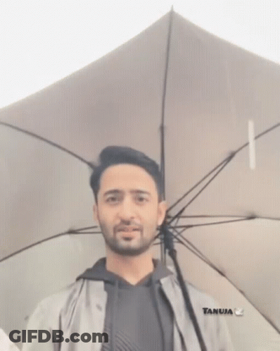 Bearded Man Holding White Umbrella GIF