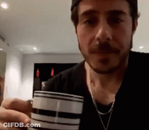 Bearded Man Holding Wine Glass GIF