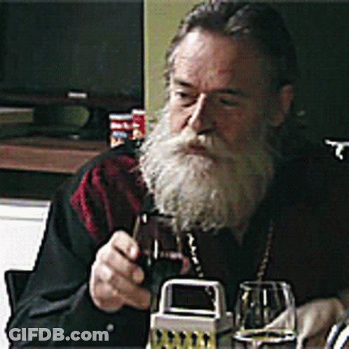Bearded Man Holding Wine Glass GIF