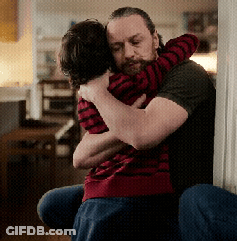 Bearded Man Hugging Child In Red And Black Striped Shirt GIF