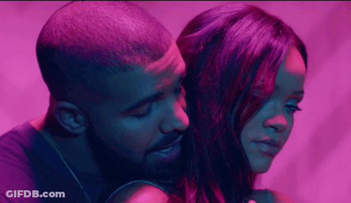 Bearded Man Hugging Woman In Purple Light GIF