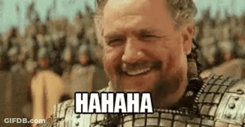 Bearded Man In Armor Laughing Before Crowd GIF