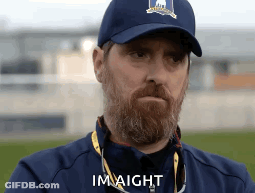 Bearded Man In Baseball Cap And Jacket Says Im Aight GIF