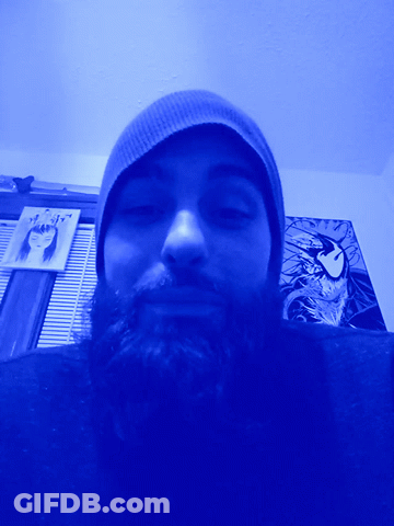 Bearded Man In Beanie Under Blue Light GIF