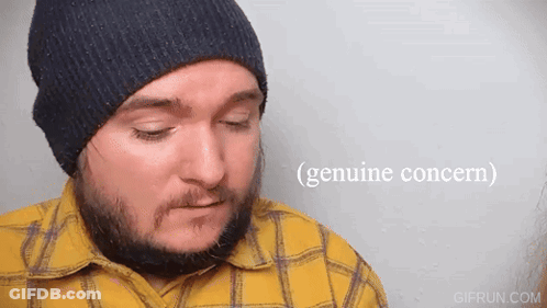Bearded Man In Beanie Yellow Plaid Shirt Expresses Genuine Concern GIF
