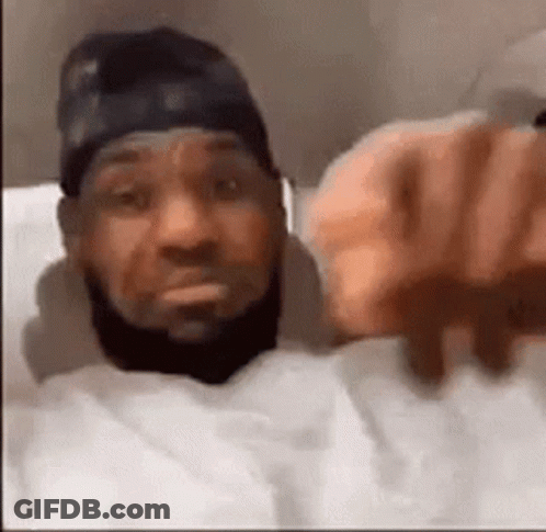 Bearded Man In Bed Pointing GIF