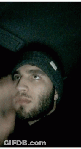 Bearded Man In Black Beanie Shushing GIF