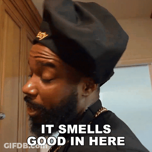 Bearded Man In Black Hat Says It Smells Good GIF