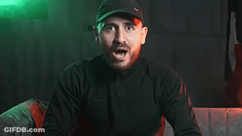 Bearded Man In Black Hat Screaming In Dark Room GIF