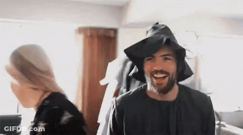 Bearded Man In Black Hat Smiling Near Woman GIF