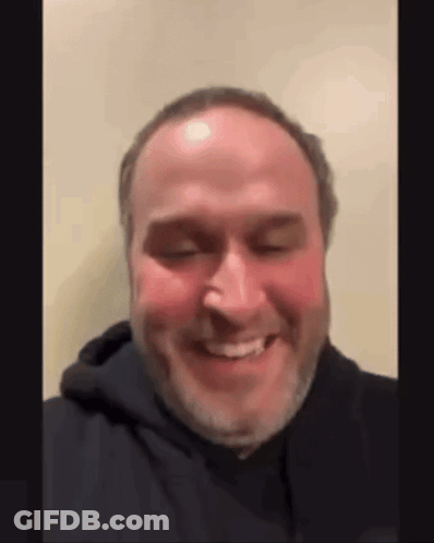 Bearded Man In Black Hoodie Smiling GIF