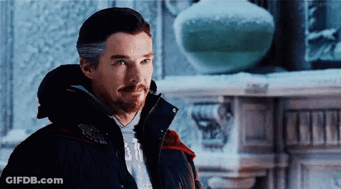Bearded Man In Black Jacket By Fireplace In Snow GIF