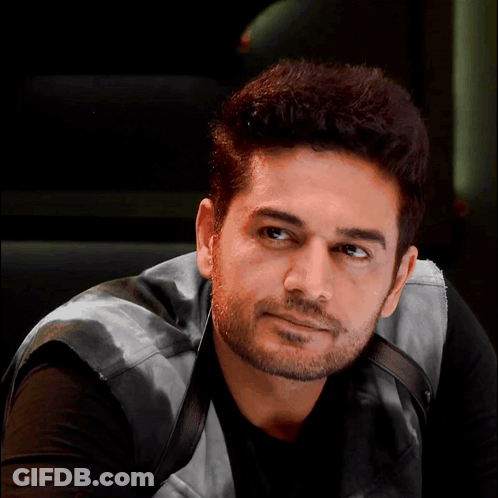 Bearded Man In Black Shirt And Leather Vest GIF