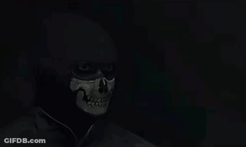 Bearded Man In Black Shirt In Dark GIF