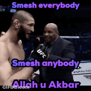 Bearded Man In Black Shirt Looking At Camera GIF