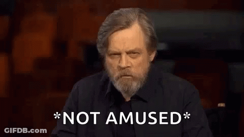 Bearded Man In Black Shirt Says Not Amused GIF