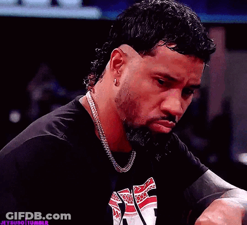 Bearded Man In Black Shirt With Chain And Earrings GIF