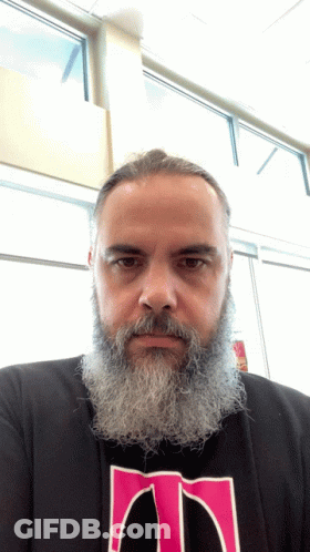 Bearded Man In Black Shirt With Pink T GIF